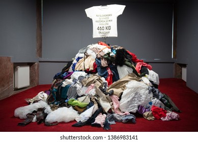 BRATISLAVA, SLOVAKIA - MAY 1, 2019: Installation Of Pile Of Old Worn Clothes During Fashion Revolution Week. Approximately 460 Kgs Of Clothes Is Thrown Away Every 10 Minutes In Slovakia.