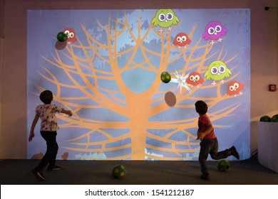 BRATISLAVA, SLOVAKIA - OCT 25, 2019: Kids Playing Interactive Game Projected To The Wall At The Mall In Bratislava, Slovakia