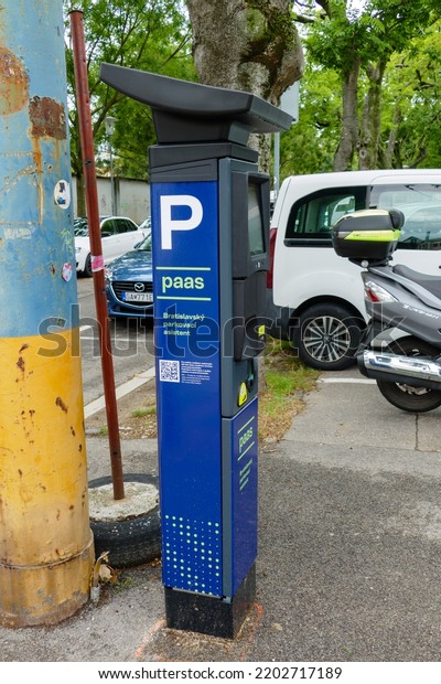Bratislava,
Slovakia - September 16, 2022: Parking vending machine of Paas
system. New parking system in Bratislava. Machine with parked cars
in background. Banskobystrická street.
