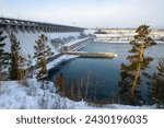 Bratsk hydroelectric power station, Bratsk city, Irkutsk region, Siberia, Russia. Large hydroelectric power station on the Angara River. View of the dam and the hydroelectric power station building.