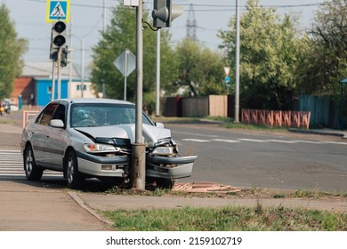 Bratsk, Russia - May 5, 2022: The car crashed into a pole at a crosswalk.