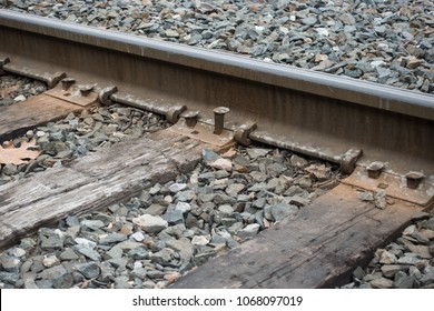 BRATTLEBORO, VT - APR. 2018: Loose Railroad Spike, Close Up, Holding Plate On Wooden Rail Road Tie.  Not Necessarily A Hazard Since Rest Of Track Is Well-secured To Ties.