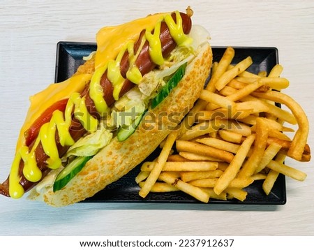 Similar – Foto Bild Fischbrötchen und Bratwurst/Pommes-Werbung auf einem Imbissdach