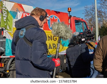 Braunschweig, Germany, November 30., 2019: TV Crew, Cameo Man With Video Recorder And Sound Engineer With Microphone With Windscreen, At The Edge Of A Demonstration