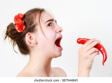 Brave, Daring And Fearless Young Girl  With Hot Red Pepper