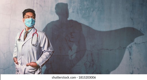 Brave Doctors With His Shadow Of Superhero On The Wall. Concept Of Powerful Man