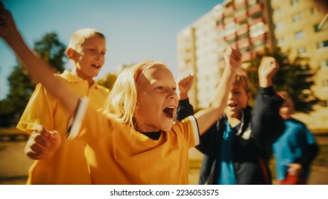 Brave Girl Playing Soccer with Neighborhood Boys. Young Football Player Dribbling, Kicking a Ball Successfully to Score a Goal. Diverse Friends Hug and Celebrate the Victory. - Shutterstock ID 2236053575