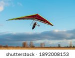 Brave girl student is mastering hang gliding sport. Extreme sports activity