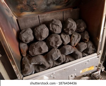 BRAY, CO. WICKLOW, IRELAND - SEPTEMBER 12, 2020: Closeup View Of The Artificial Coals Inside Of The Home Gas Fireplace. The Fireplace With Removed Covering Glass Screen, Ready For Annual Cleaning.