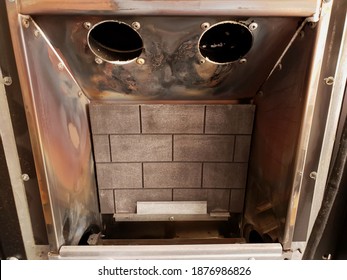 BRAY, CO. WICKLOW, IRELAND - SEPTEMBER 12, 2020: Closeup View Of The Inside Of The Home Gas Fireplace. Cleaned Fireplace After Annual Cleaning.