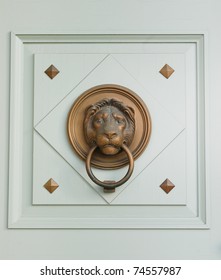 Brazen lion head door knocker