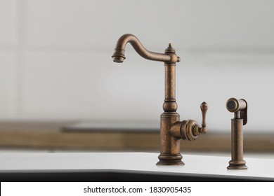 Brazen Old-style Facet With Small Lever For Kitchen. Brown Crane In The Close-up Photo.Modern Furniture. Copper Sink As Kitchen Equipment. Macro Photo With High Quality.