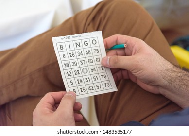 Goiânia, Goiás, Brazil: 05/10/2019 - Man Holding Bingo Card