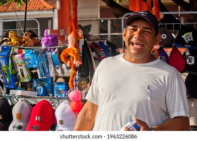 Santarém, Pará, Brazil. 5-15-2015. Smiling Hawker Full Of Colorful Chinese Products