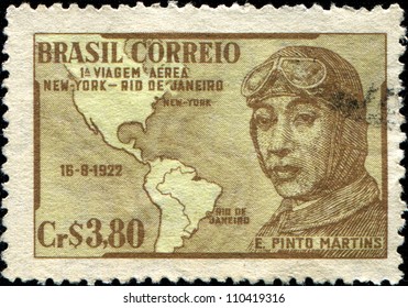  BRAZIL - CIRCA 1951: A stamp printed in Brazil honoring 29th Anniversary of First Rio - New York Flight, shows E Pinto Martins and Map, circa 1951