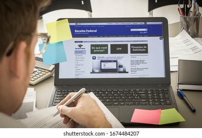 Brazil, March 11, 2020 - Brazilian Receita Federal Page Open On The Notebook Screen On Top Of An Office Bench