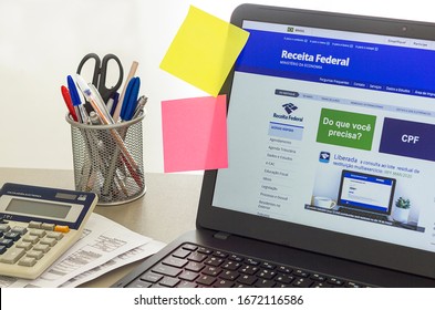 Brazil, March 12, 2020 - Brazilian Receita Federal Page Open On The Notebook Screen On Top Of An Office Bench