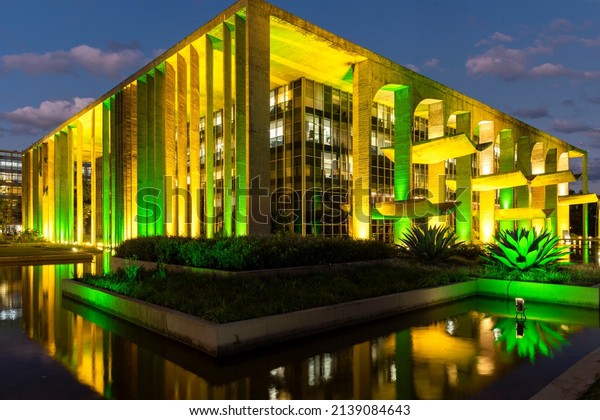 Brasília, Brazil - March 24, 2022: Ministry of Justice\
and Public Security\
is illuminated with green and yellow colors.\
