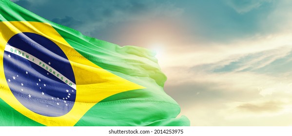 Brazil National Flag Waving In Beautiful Sky.