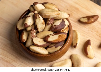 Brazil nuts peeled from the shell on the table, peeled Brazil nut fruits scattered on the table - Shutterstock ID 2256447647