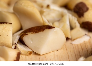 Brazil nuts peeled from the shell on the table, peeled Brazil nut fruits scattered on the table - Shutterstock ID 2257575837