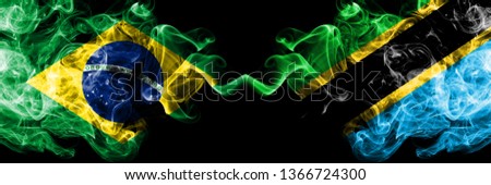 Brazil vs Tanzania, Tanzanian smoke flags placed side by side. Thick colored silky smoke flags of Brazilian and Tanzania, Tanzanian