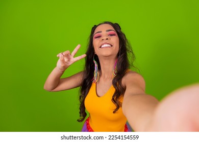 Brazilian afro woman, dressed in  clothes carnival taking a selfie. - Powered by Shutterstock