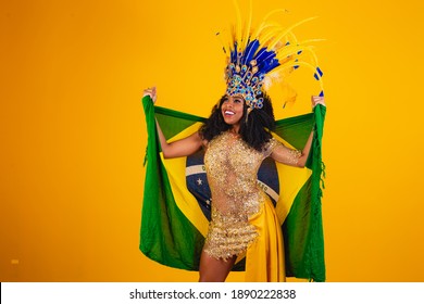 Brazilian Afro Woman Posing In Samba Costume On Yellow Background With The Flag Of Brazil