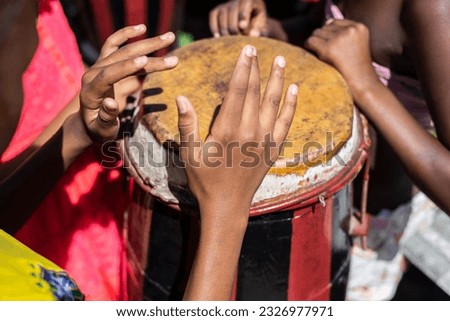 Brazilian atabaque being played by the hands of a musician. Feeling of power and speed. Constant pace. Acupe, Santo Amaro, Bahia.