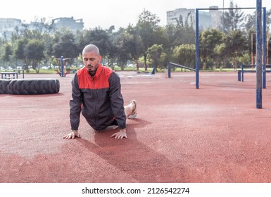 Brazilian Bald Man Doing Cobra Stretch With Eyes Closed