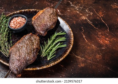 Brazilian BBQ - Grilled Dry Aged Picanha Beef Steak With Herbs. Dark Background. Top View. Copy Space.