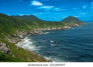 Brazilian beach Cabo Frio Rio de Janeiro blue sky blue sea mountains background cove white waves coastal landscape green hills rocky coastline waves gently break rocks



 - Powered by Shutterstock