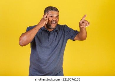 Brazilian Black Man, Adult Pointing Something Distant With His Finger, Surprised.