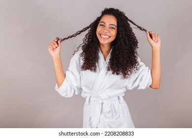 Brazilian Black Woman, Wearing Bathrobe And Towel. Curly Hair, Spa, Beauty Center, Hair Care. Showing Hair. Curls.