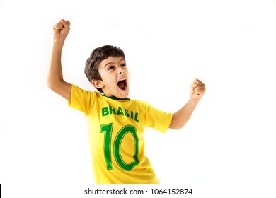 Brazilian Boy, Soccer Player And Fan, Celebrates On White Background. Cheering Faces. Hands Up
