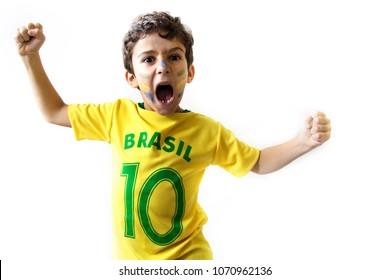 Brazilian Boy, Soccer Player And Fan, Celebrates On White Background. Cheering Faces. Hands Up
