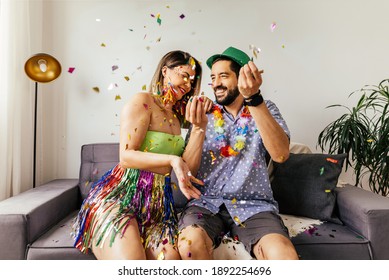 Brazilian Carnival. Couple celebrating carnival at home - Shutterstock ID 1892254696