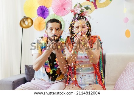 Similar – Young couple celebrating a party with their dog