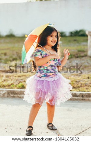 Brazilian Carnival. Little girl in costume enjoying the carnival party