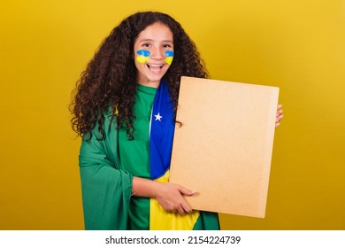 Brazilian Caucasian Girl Soccer Fan Holding Sign For Announcement, Text, Advertisement. World Cup. Olympics.