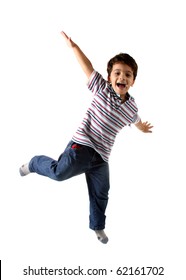 A Brazilian and caucasian kid playing on a studio with white background and isolated on white. The child is wearing jeans, shirt and shows a real expression of fun.