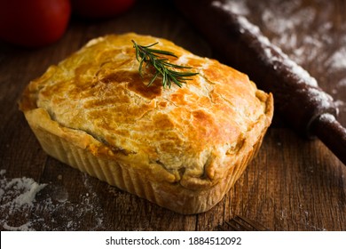 Brazilian Chicken Pie - homemade chicken meat pie isolated on wooden table - Shutterstock ID 1884512092