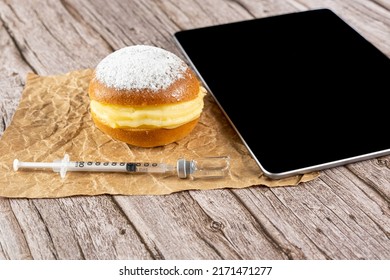 Brazilian Cream Doughnuts Next To A Syringe Taking Insulin From An Ampoule And A Tablet_side View.