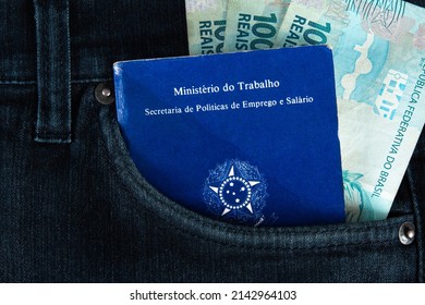 Brazilian Document Work And Social Security (Carteira De Trabalho E Previdencia Social) In The Pocket Of His Jeans With One Hundred Reais Bills. Brazilian Money.