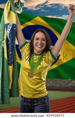 Brazilian female Athlete Winning a golden medal in front of a brazilian flag.