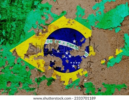 Brazilian flag on mud wall.