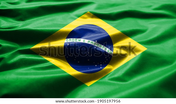 Brazilian\
flag waving in the wind. Close up of Brazil banner blowing, soft\
and smooth silk. Cloth fabric texture ensign background. Use it for\
national day and country occasions\
concept.