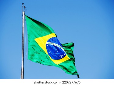 Brazilian Flag Waving Waving In The Wind Lit By The Sun