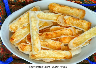 Brazilian Food: Crunchy Beiju, Type Of Dry Pancake Made From Manioc Starch, With Butter And Cheese, On Table With Colorful Tablecloth