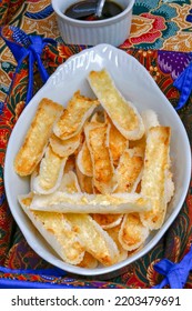 Brazilian Food: Crunchy Beiju, Type Of Dry Pancake Made From Manioc Starch, With Butter And Cheese, On Table With Colorful Tablecloth